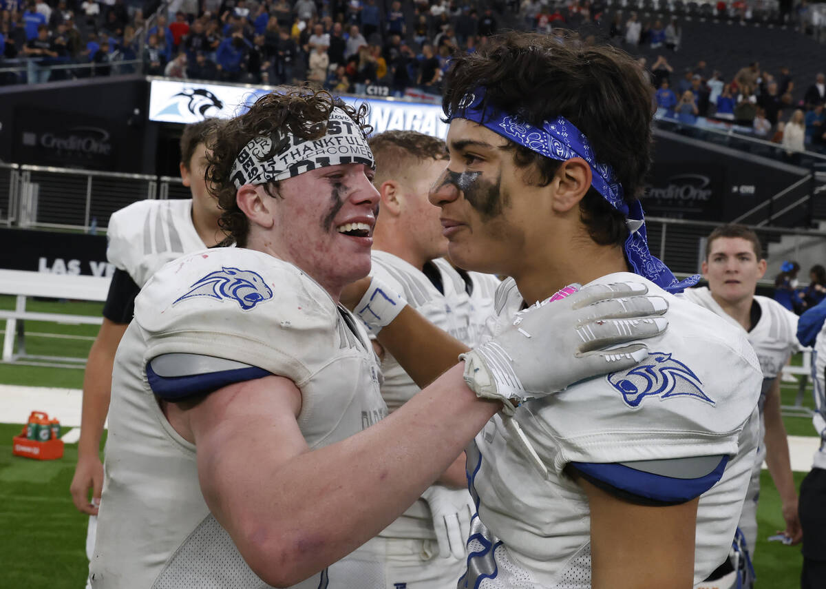 Pahranagat Valley running back A.J. Thornton (7) and defensive back Bronson Fiatoa (8) get emot ...