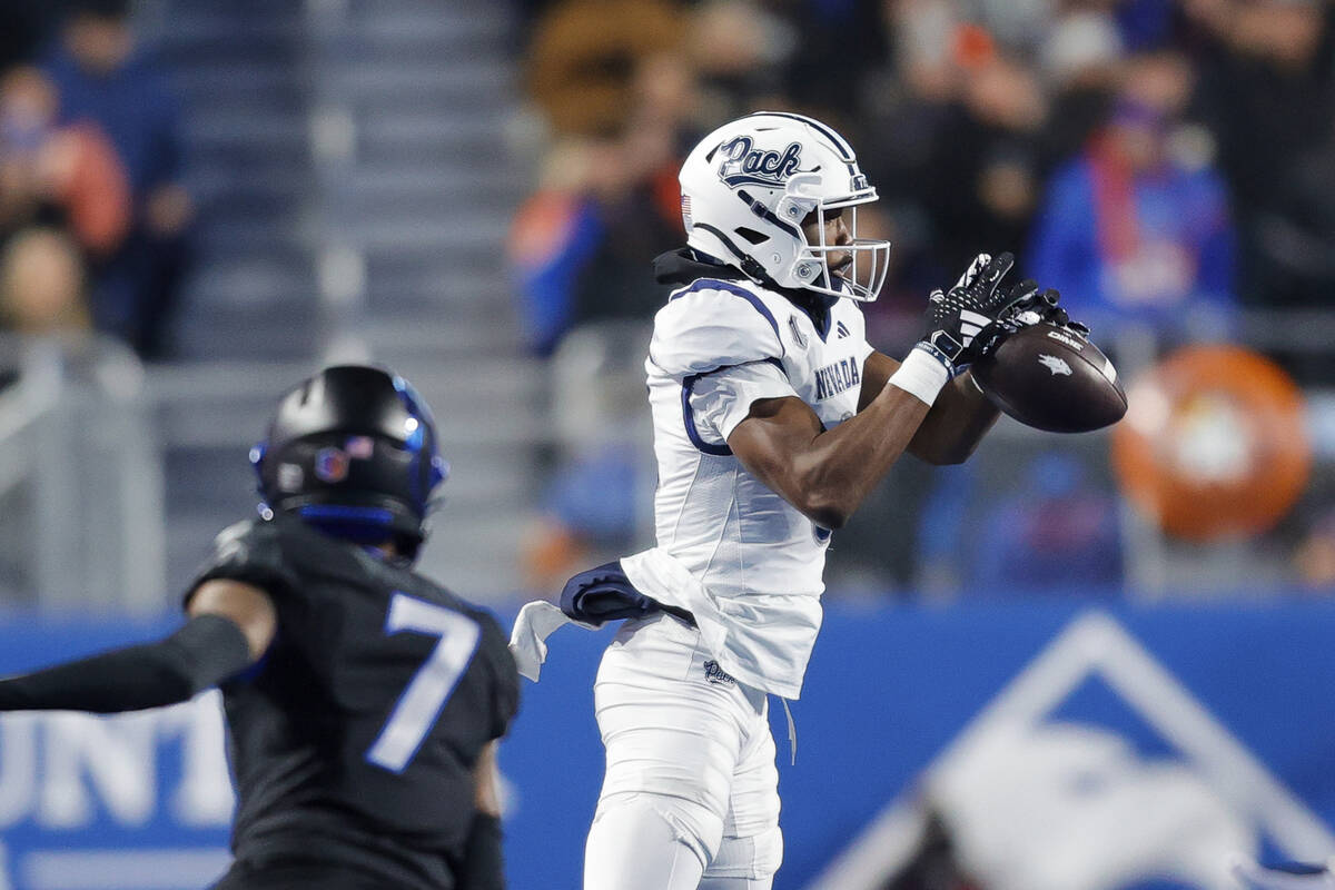 Nevada wide receiver Cortez Braham Jr. (8) catches the ball in front of Boise State cornerback ...