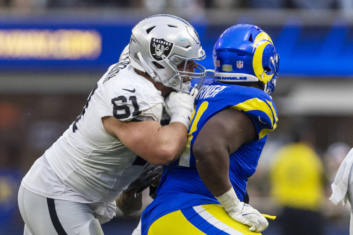 Raiders guard Jordan Meredith (61) blocks Los Angeles Rams defensive tackle Kobie Turner (91) d ...