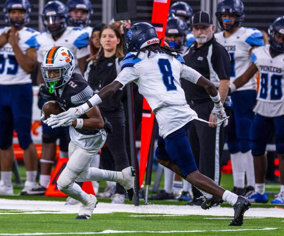 Mojave wide receiver Arthur AJ Williams (2) evades a tackle attempt by Canyon Springs cornerbac ...