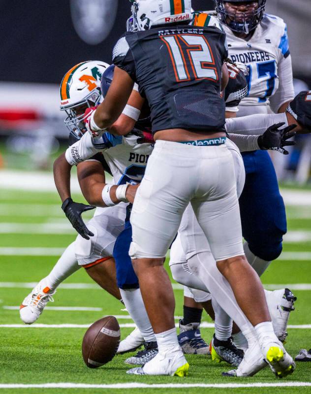 Canyon Springs running back Bakari Wilson (21) fumbles the ball against Mojave during the first ...