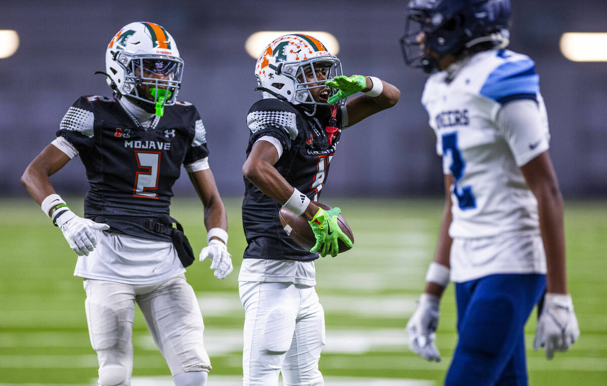 Mojave wide receiver Ja'laun Miller (4) celebrates a touchdown catch against Canyon Springs dur ...