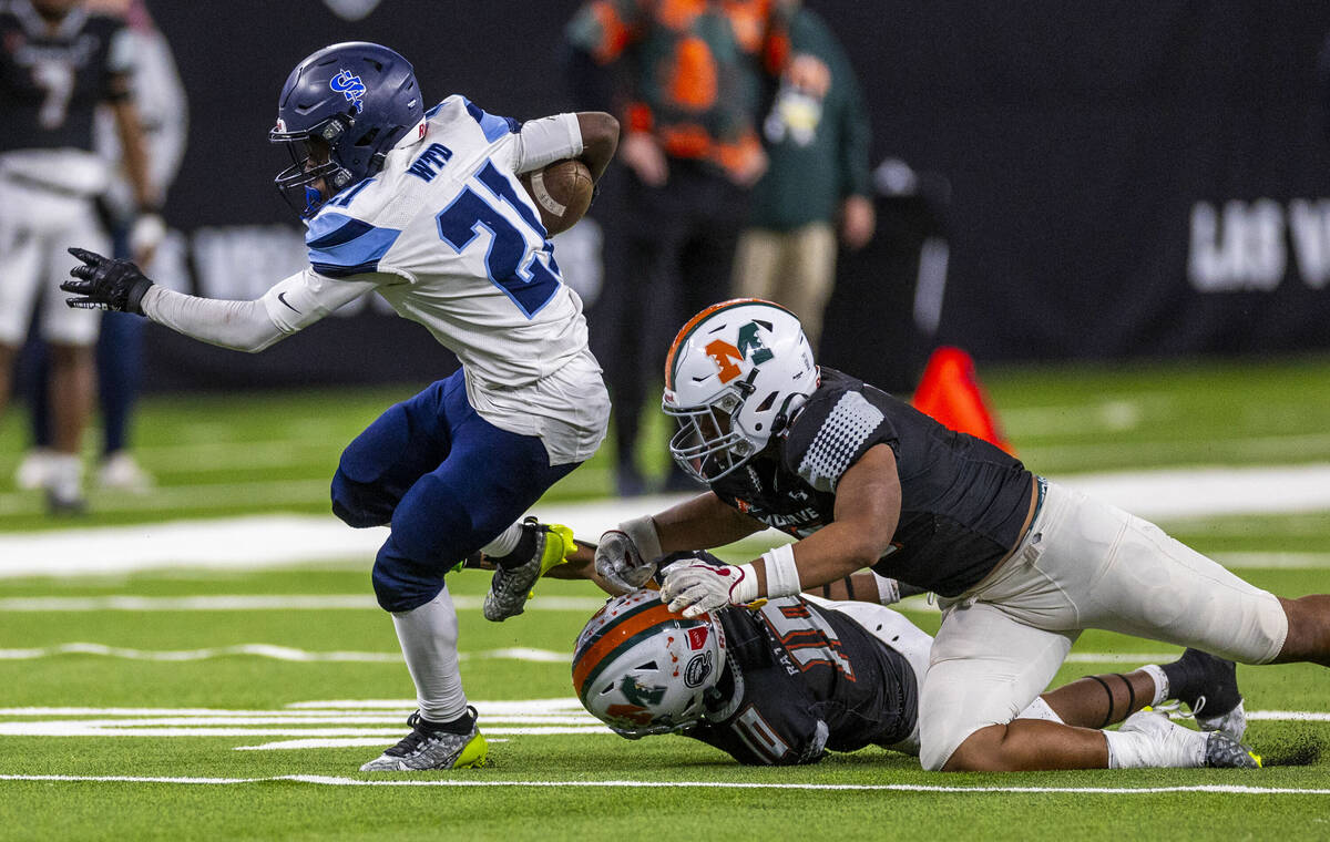 Canyon Springs running back Bakari Wilson (21) breaks free against Mojave during the second hal ...