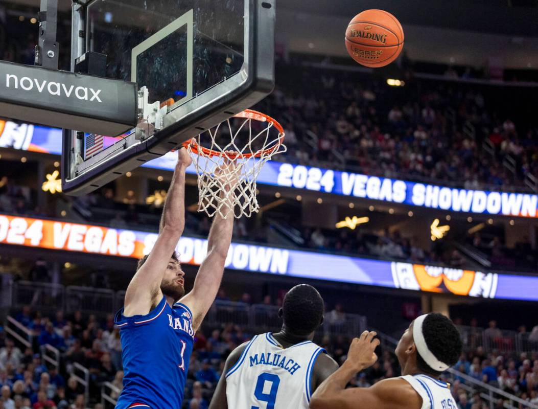 Kansas Jayhawks center Hunter Dickinson (1) watches the ball fly off the rim after missing a du ...