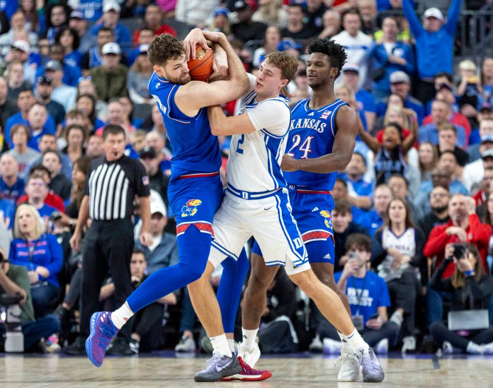 Kansas Jayhawks center Hunter Dickinson, left, and Duke Blue Devils guard Cooper Flagg (2) comp ...