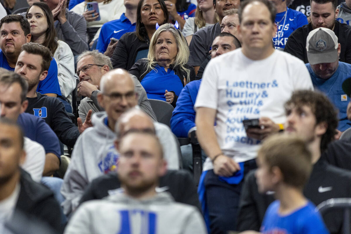 Duke Blue Devils fans sit in silence during the first half of the Vegas Showdown college basket ...