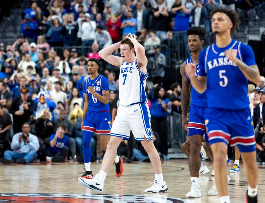 Duke Blue Devils guard Kon Knueppel (7) holds his hands above his head after missing a game tyi ...