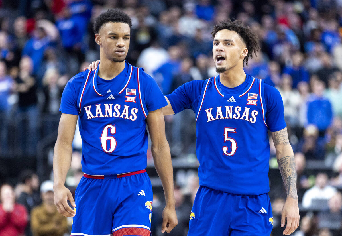 Kansas Jayhawks guard Rylan Griffen (6) and guard Zeke Mayo (5) talk during the Vegas Showdown ...