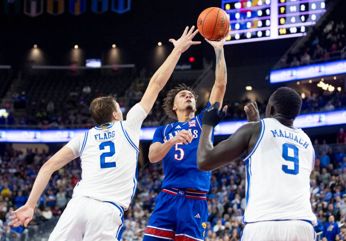 Kansas Jayhawks guard Zeke Mayo (5) attempts a shot during the Vegas Showdown college basketbal ...