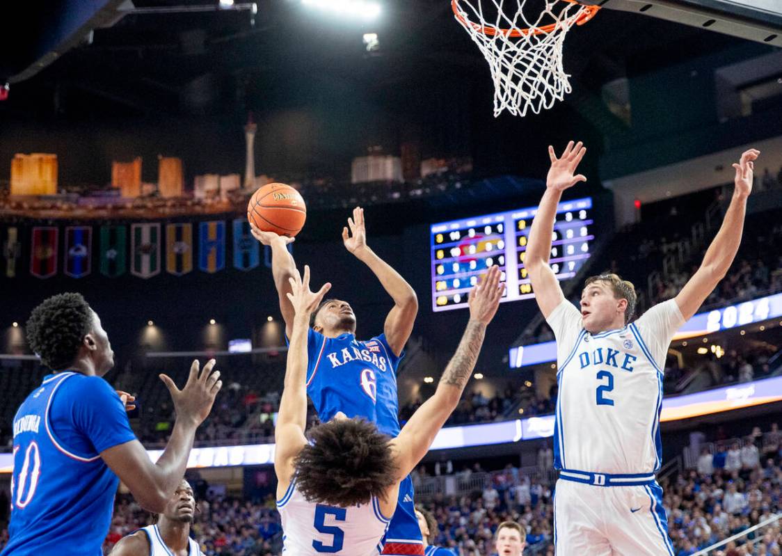 Kansas Jayhawks guard Rylan Griffen (6) attempts a shot during the Vegas Showdown college baske ...