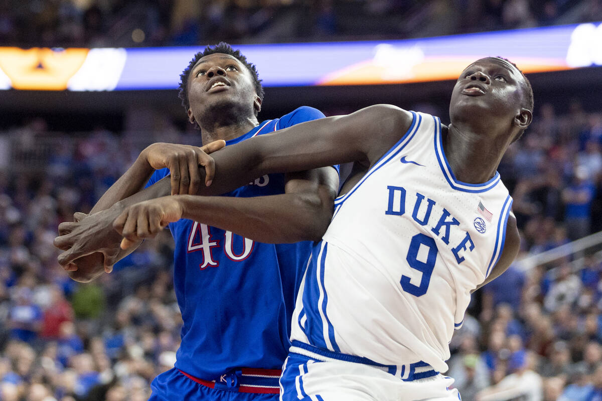 Kansas Jayhawks forward Flory Bidunga (40) and Duke Blue Devils center Khaman Maluach (9) compe ...