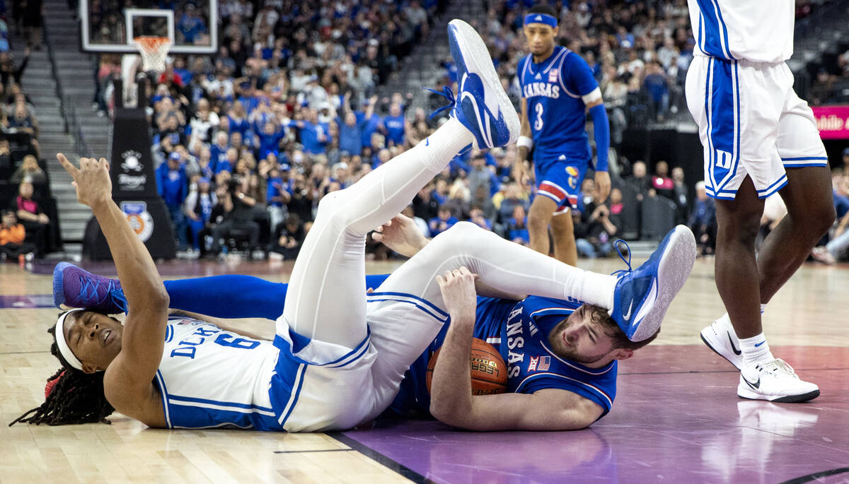 Duke Blue Devils forward Maliq Brown (6) and Kansas Jayhawks center Hunter Dickinson, right, fa ...