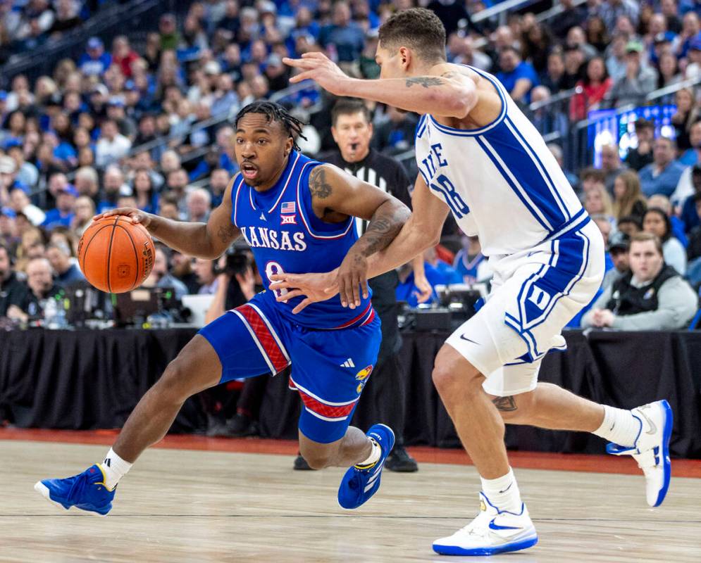 Kansas Jayhawks guard David Coit (8) rushes to the paint during the Vegas Showdown college bask ...