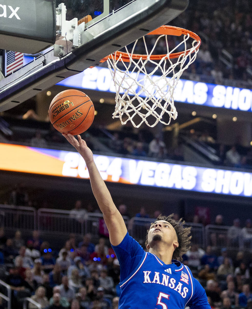 Kansas Jayhawks guard Zeke Mayo (5) attempts a layup during the Vegas Showdown college basketba ...