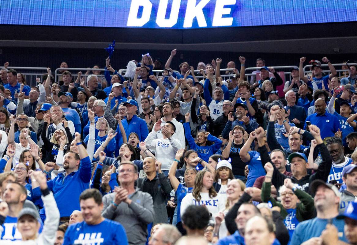 Duke Blue Devil fans cheer after the team begins to rally during the Vegas Showdown college bas ...