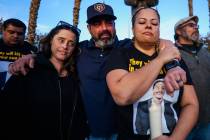 Alli Cossio, from left, Adrian Cossio and Rachael Gore take in a moment of silence during a vig ...