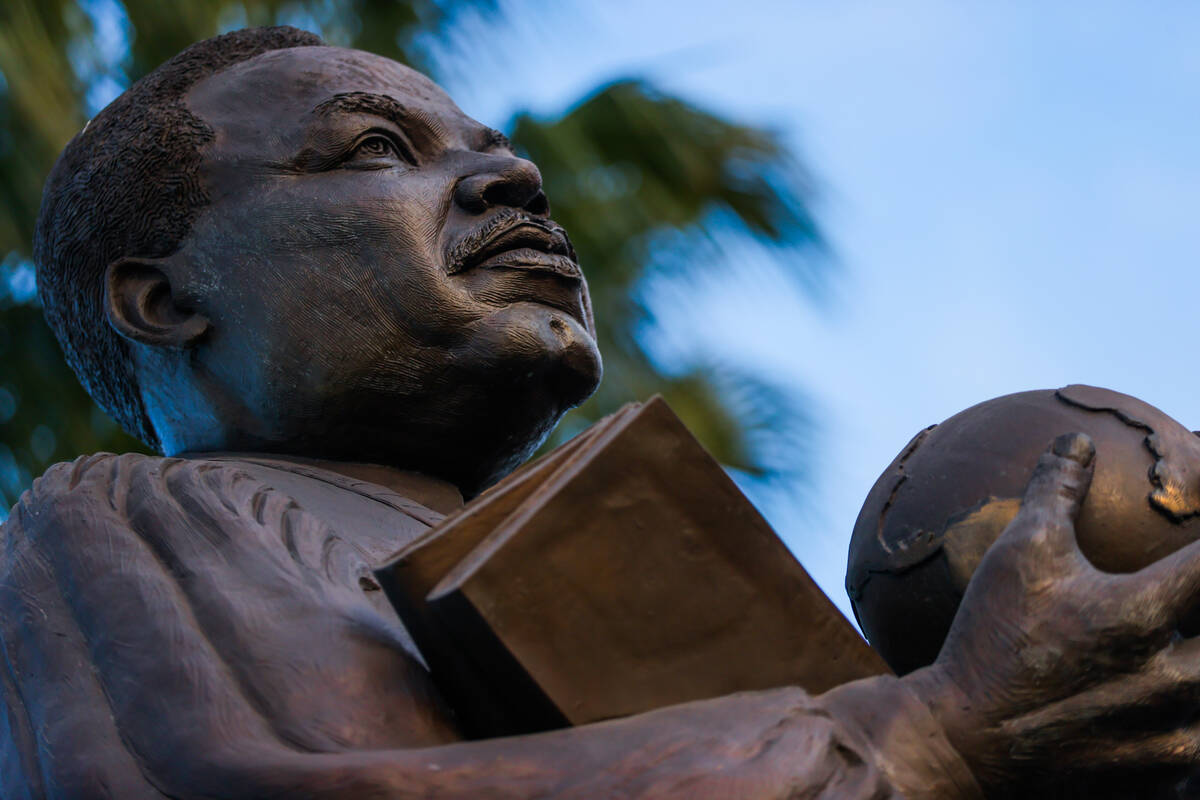 A statue of Martin Luther King Jr is seen during a vigil for Brandon Durham, who was shot and k ...