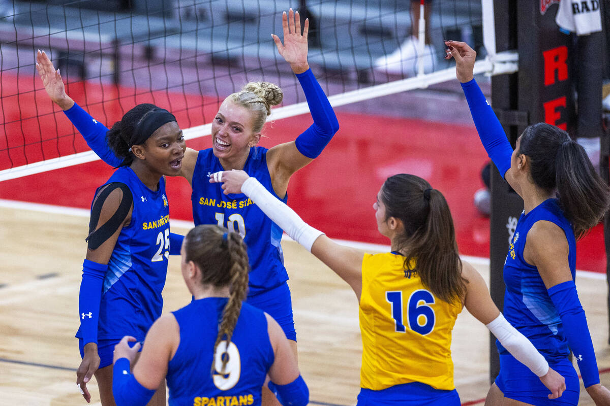 San Jose State setter Brooke Slusser (10) celebrates a point with teammates against UNLV during ...