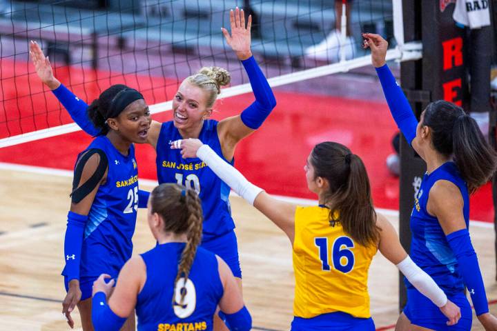 San Jose State setter Brooke Slusser (10) celebrates a point with teammates against UNLV during ...