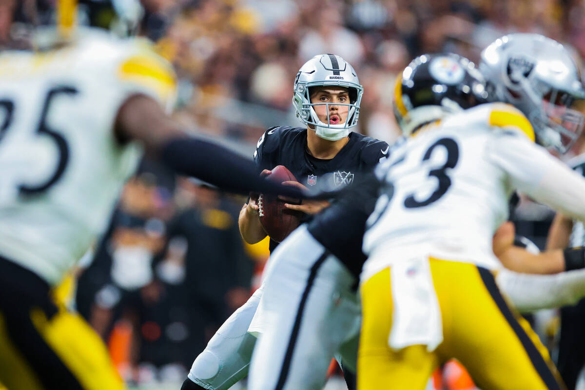 Raiders quarterback Aidan O'Connell (12) looks to throw the ball during the second half off an ...