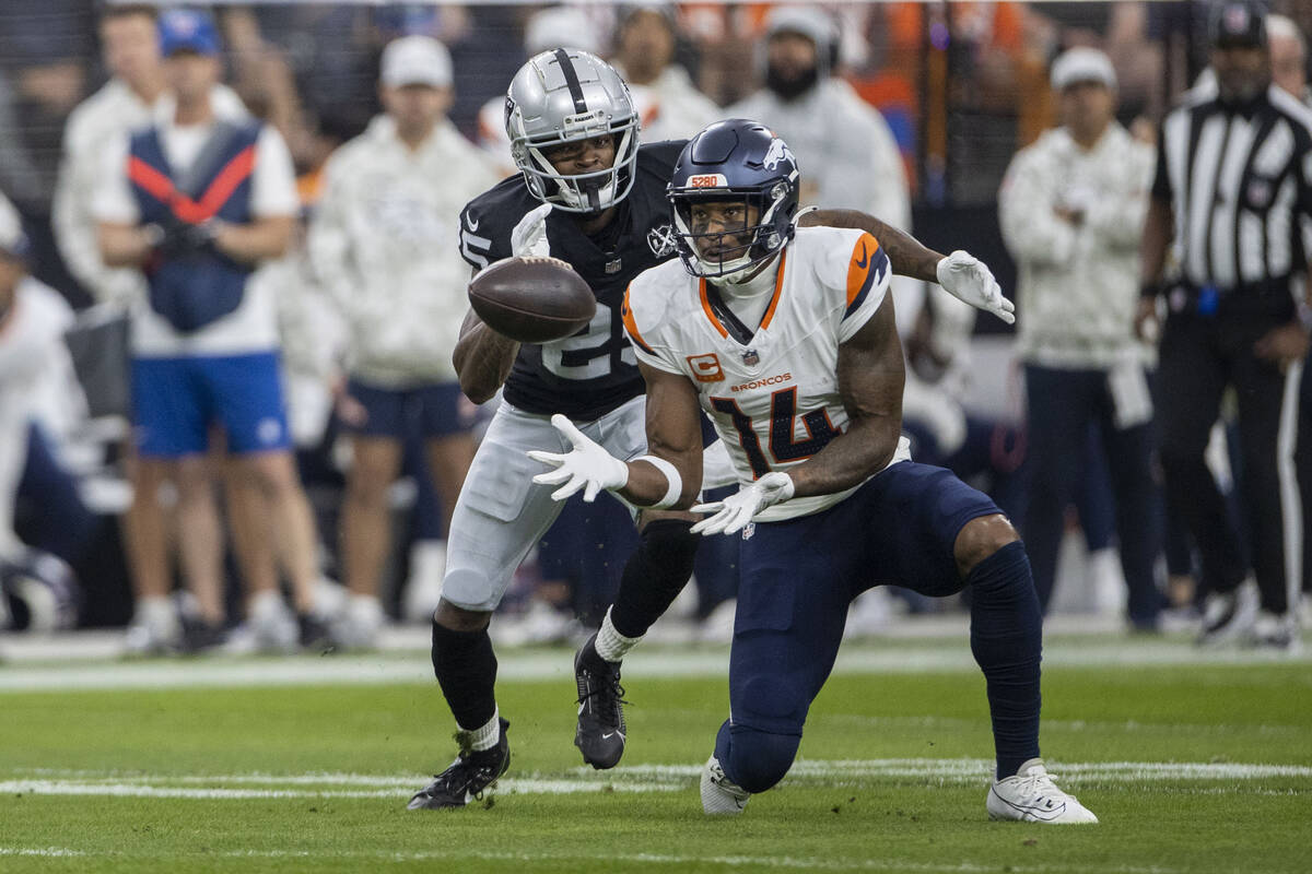 Denver Broncos wide receiver Courtland Sutton (14) prepares to catch the football as Raiders co ...