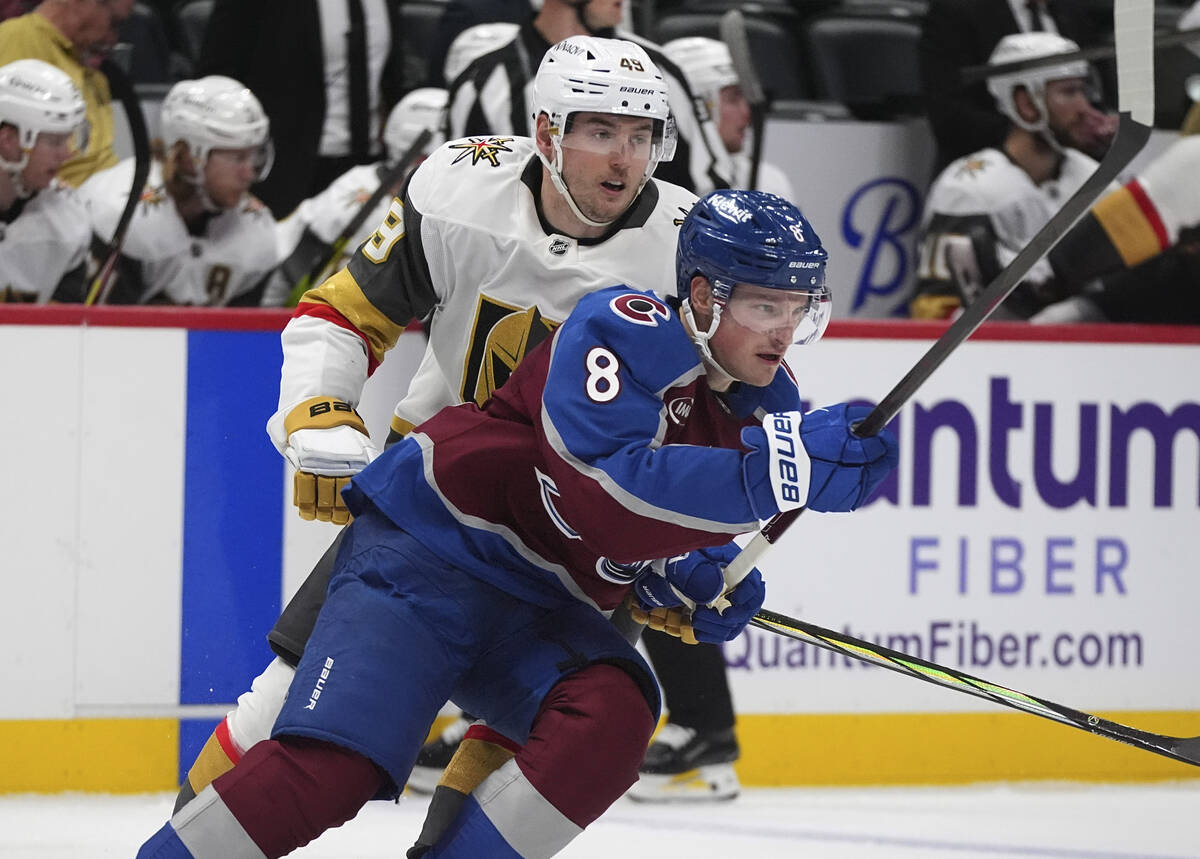 Colorado Avalanche defenseman Cale Makar, front, pursues the puck with Vegas Golden Knights cen ...