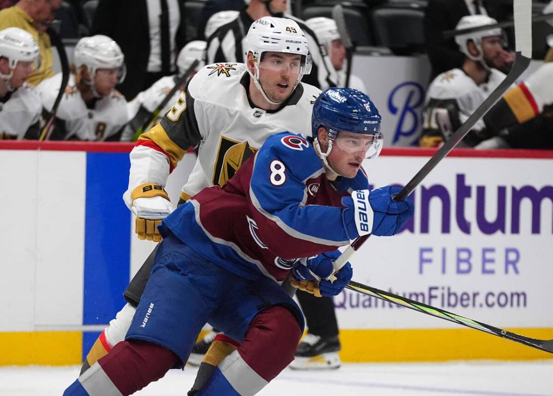 Colorado Avalanche defenseman Cale Makar, front, pursues the puck with Vegas Golden Knights cen ...