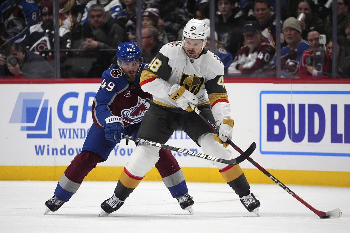 Vegas Golden Knights center Tomas Hertl, front, passes the puck as Colorado Avalanche defensema ...