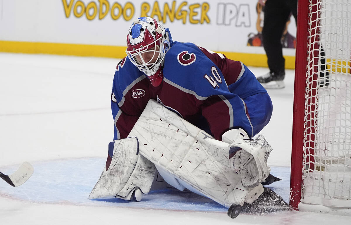 Colorado Avalanche goaltender Alexandar Georgiev stops a shot during overtime in an NHL hockey ...