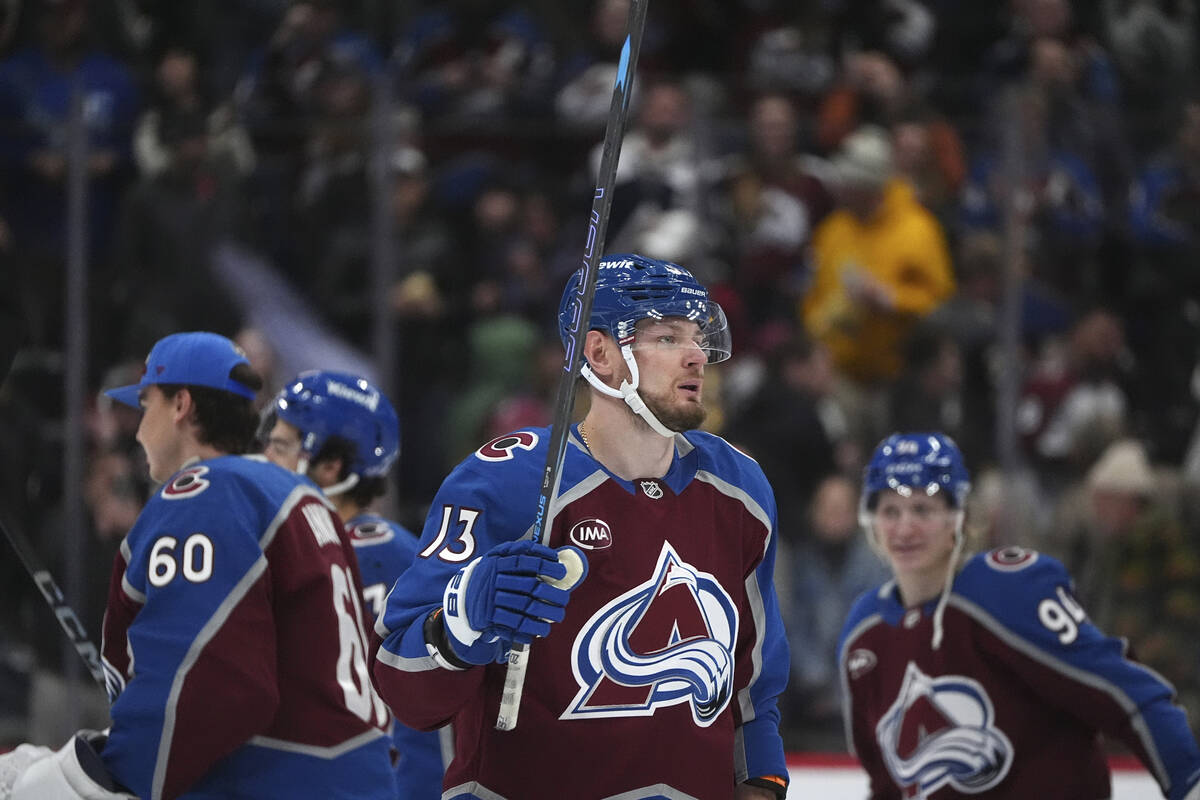 Colorado Avalanche right wing Valeri Nichushkin raises his stick to acknowledge fans after he s ...