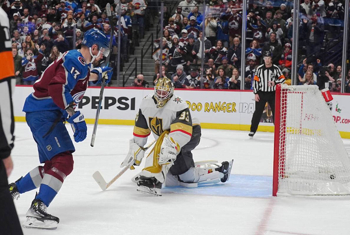 Colorado Avalanche right wing Valeri Nichushkin, left, raises his stick after scoring the winni ...