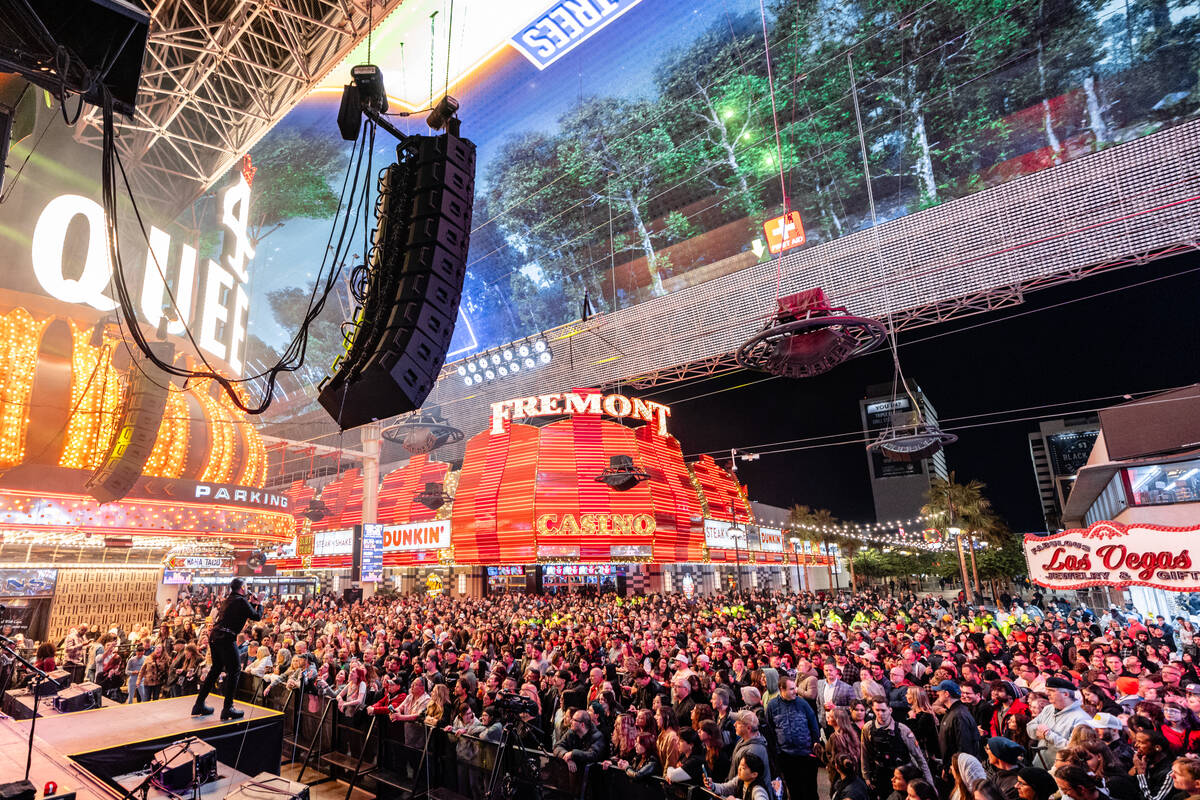 The crowd for Neon Trees is shown at Fremont Street Experience's 3rd Street Stage during Neon C ...