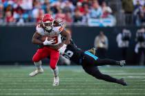 Kansas City Chiefs running back Kareem Hunt (29) is tackled by Carolina Panthers linebacker Tre ...