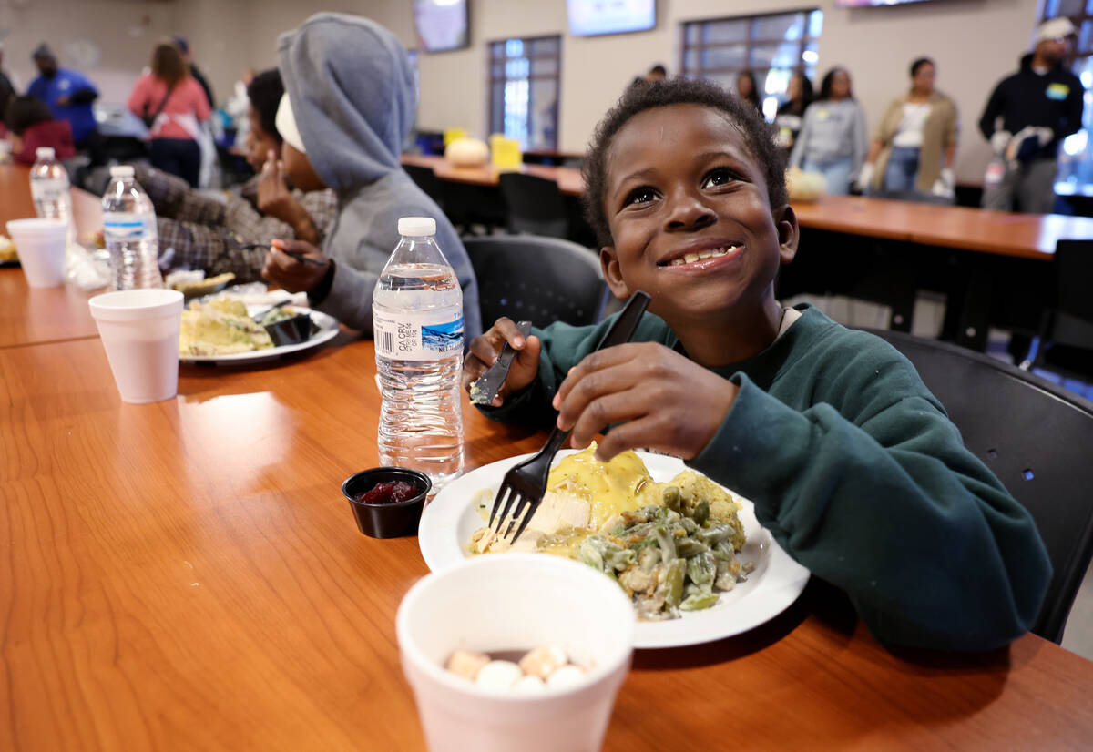 “I feel like I’m rich.” said Kadontae Moore, 7, while eating with his fami ...