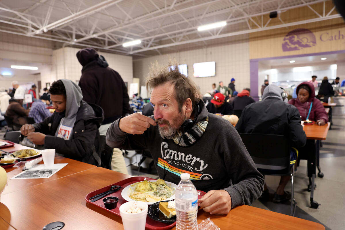 Guests eat during the Catholic Charities of Southern Nevada 59th consecutive free Thanksgiving ...