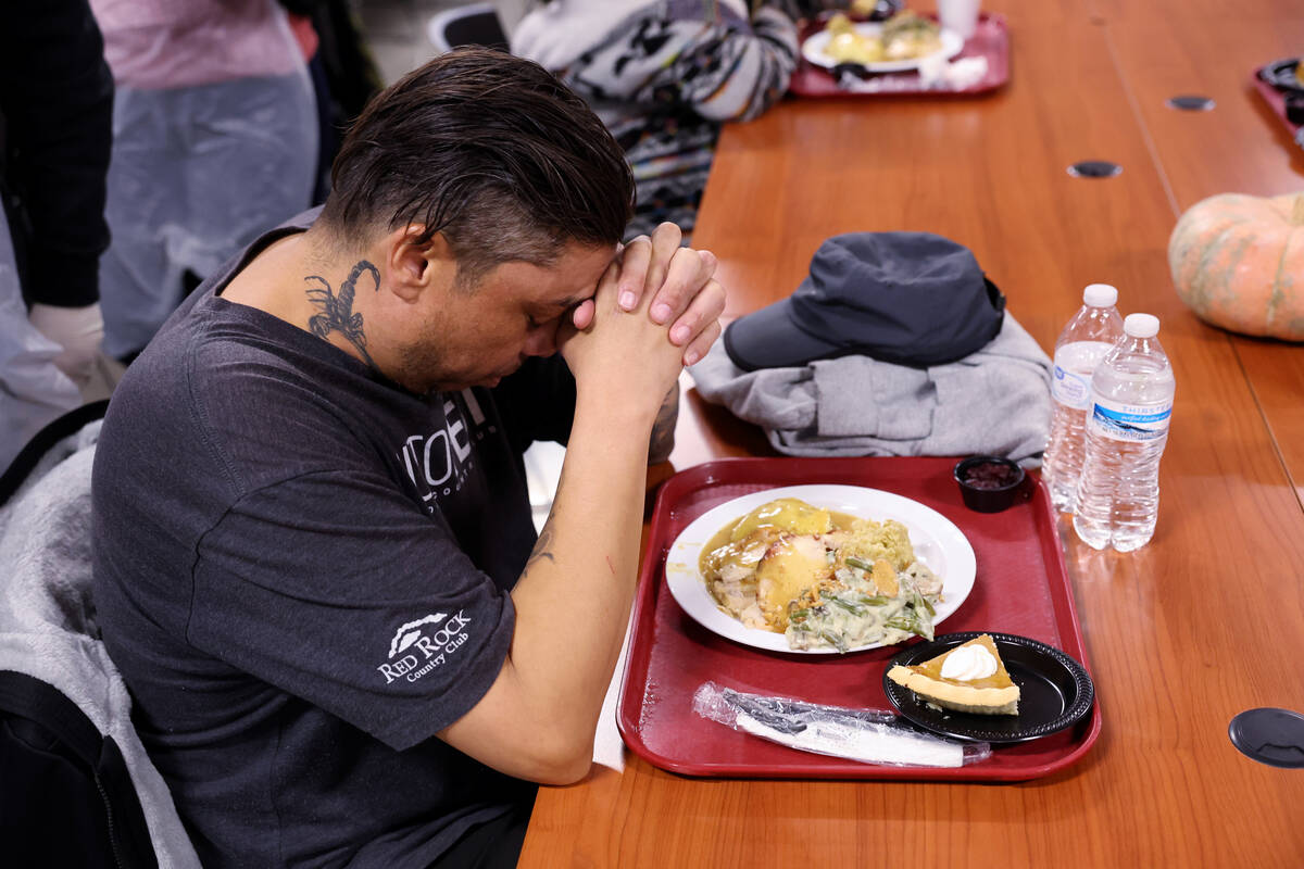 Antonio Alvarez, 45, prays during the Catholic Charities of Southern Nevada 59th consecutive fr ...