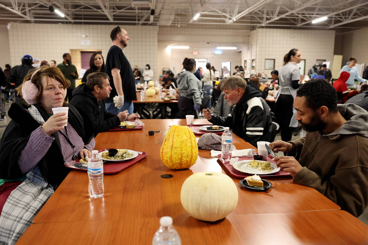 Guests eat during the Catholic Charities of Southern Nevada 59th consecutive free Thanksgiving ...