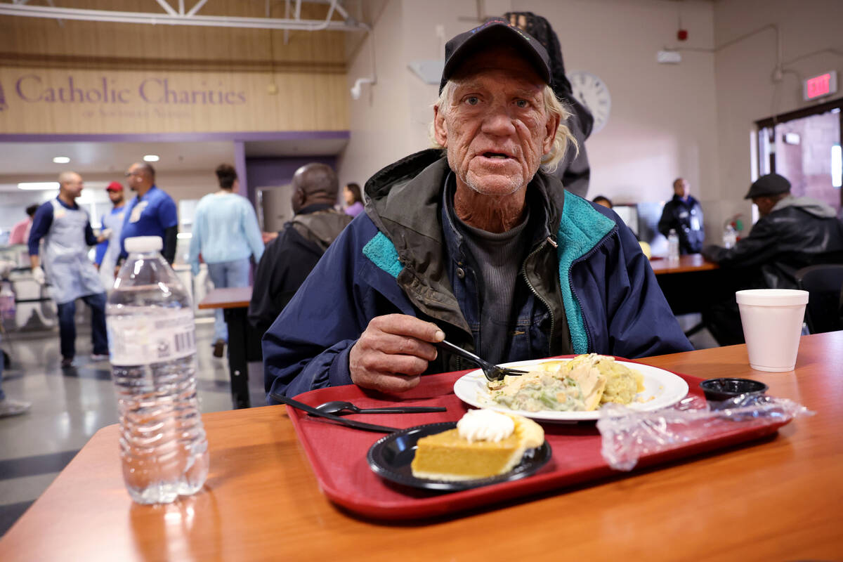 Guests eat during the Catholic Charities of Southern Nevada 59th consecutive free Thanksgiving ...