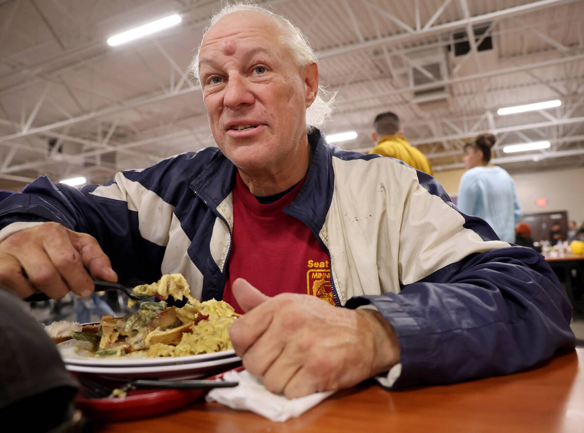 Mason Hylton, 55, eats during the Catholic Charities of Southern Nevada 59th consecutive free T ...