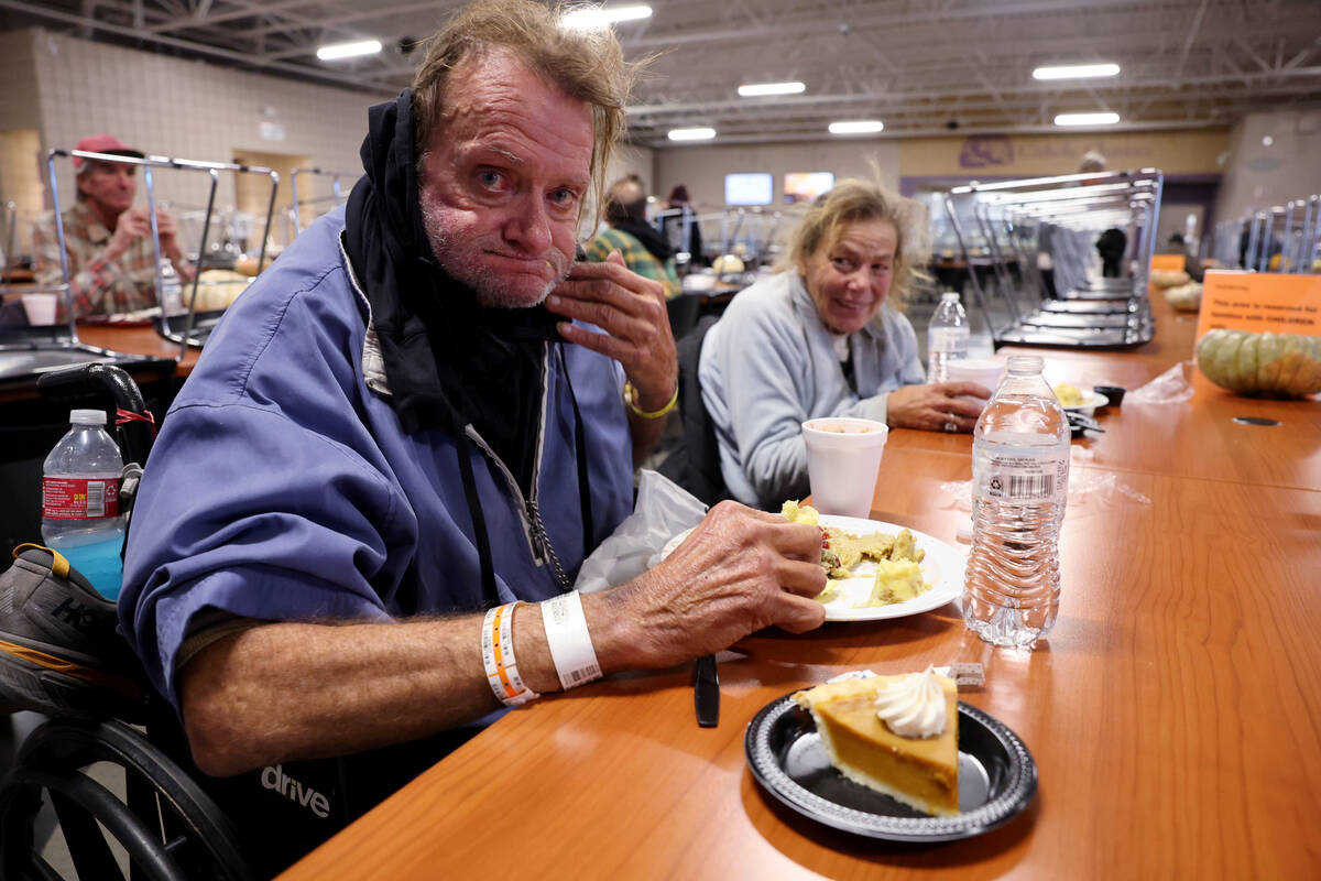 Christopher John Sweeney, 53, and Lori Johnson, 62, eat during the Catholic Charities of Southe ...