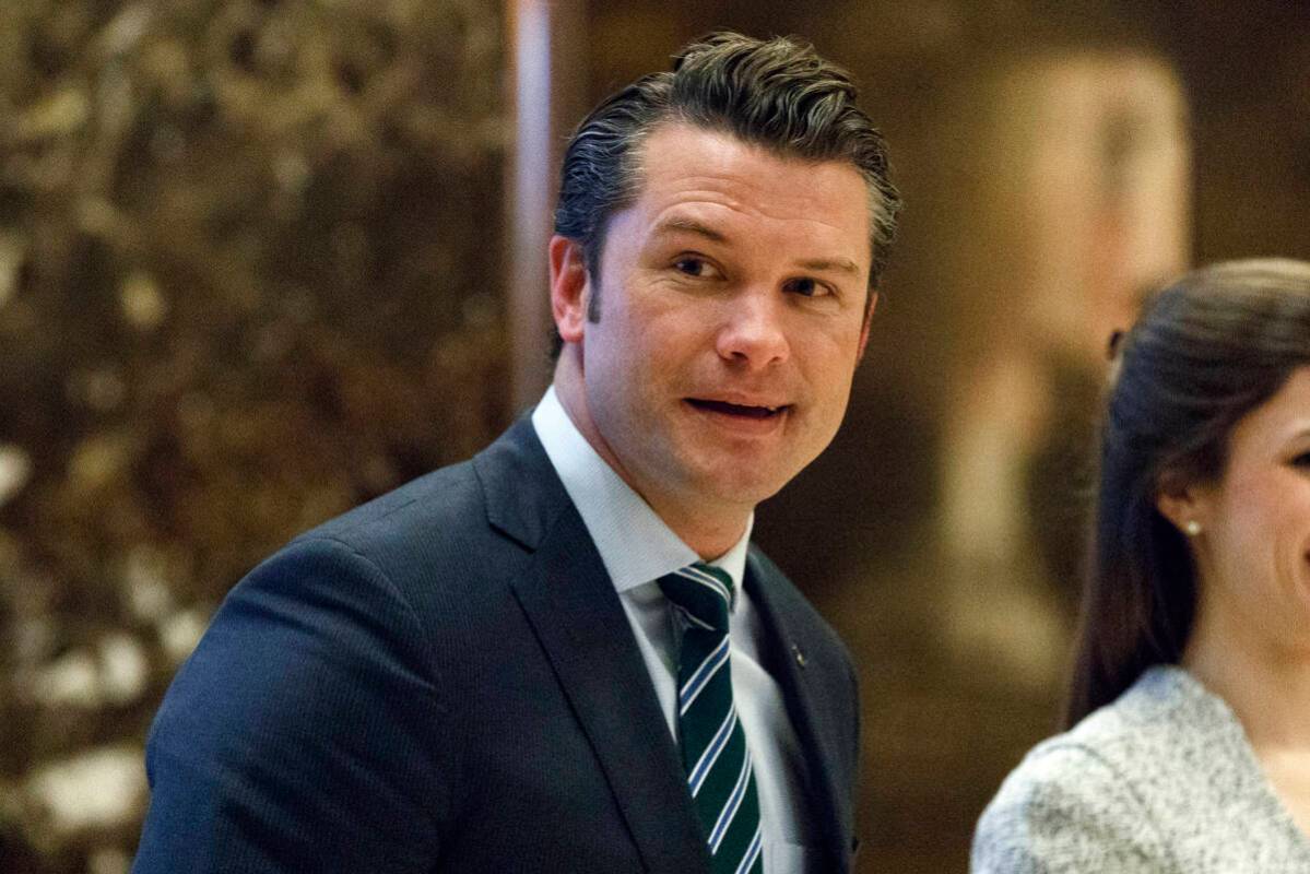 Pete Hegseth walks to an elevator for a meeting with President-elect Donald Trump at Trump Towe ...