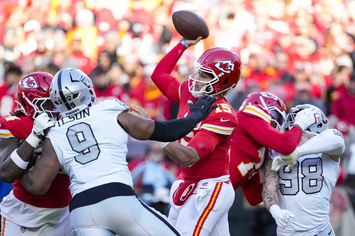 Kansas City Chiefs quarterback Patrick Mahomes (15) throws against the Las Vegas Raiders during ...