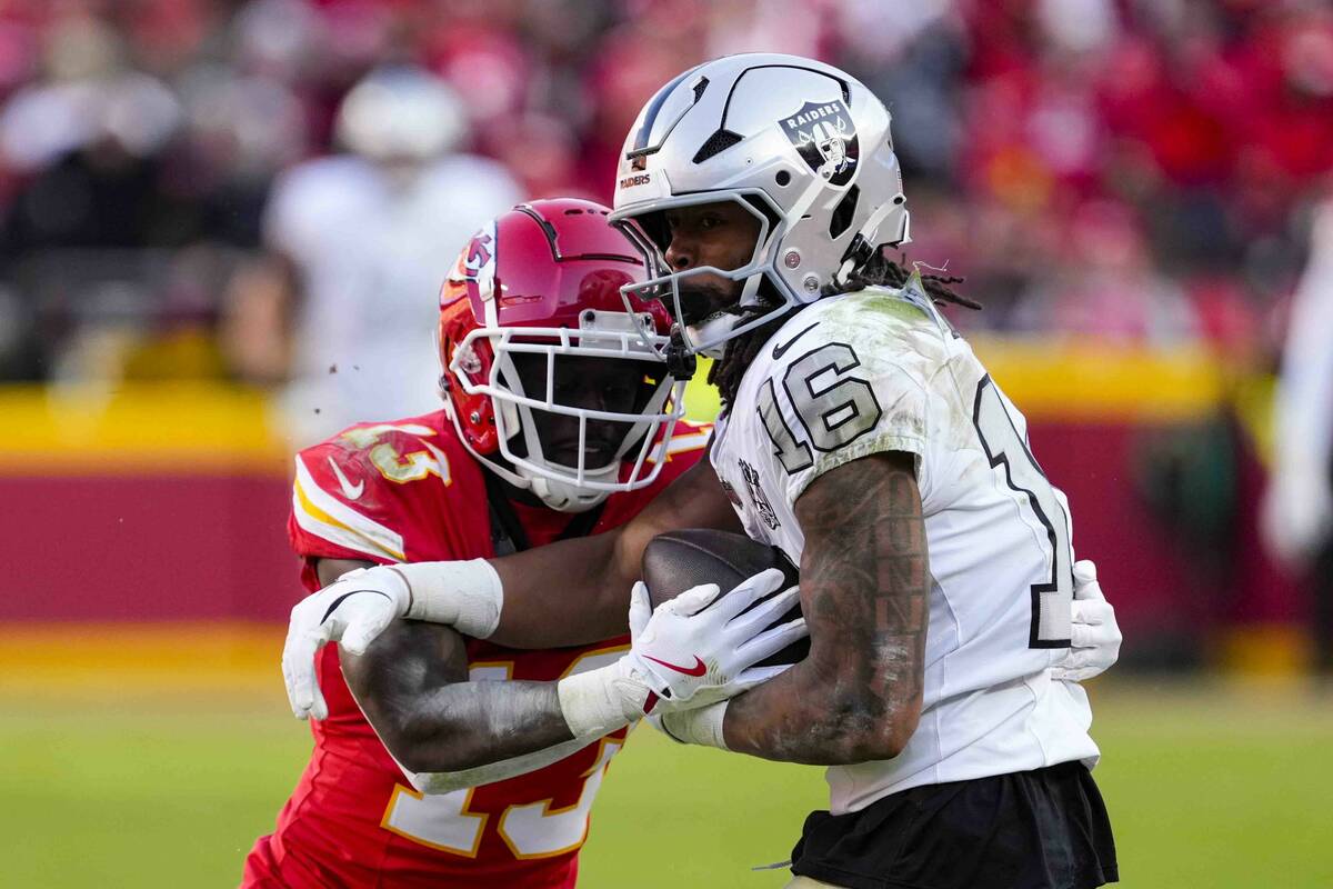 Las Vegas Raiders wide receiver Jakobi Meyers (16) is tackled by Kansas City Chiefs safety Naze ...