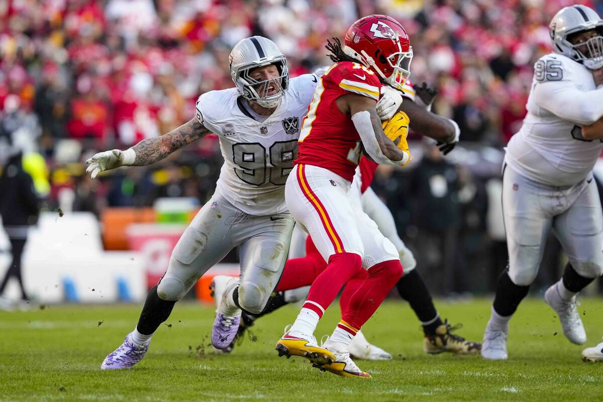 Las Vegas Raiders defensive end Maxx Crosby (98) tackles Kansas City Chiefs running back Isiah ...