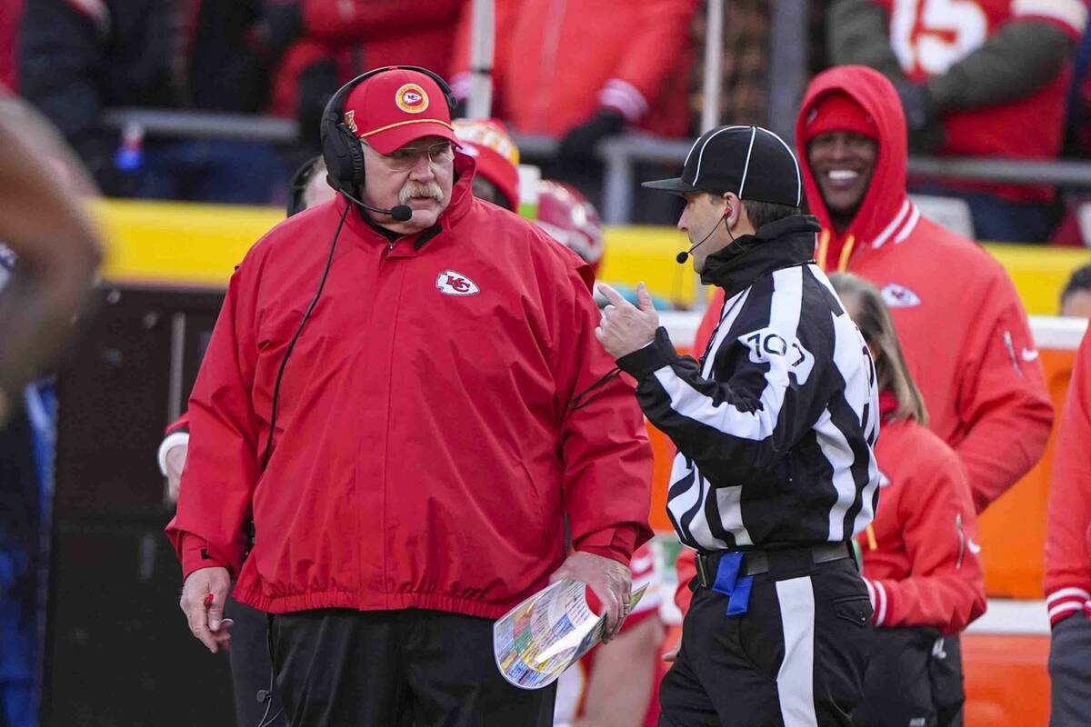 Kansan city Chiefs head coach Andy Reid talks with side judge Dave Hawkshaw (107) during the fi ...