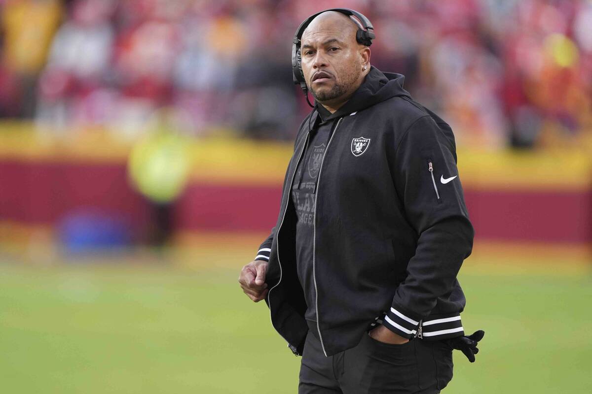 Las Vegas Raiders head coach Antonio Pierce watches from the sideline during the first half of ...