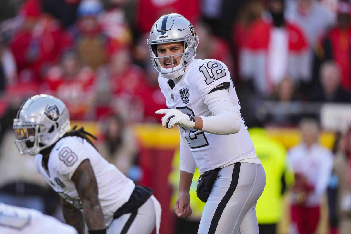 Las Vegas Raiders quarterback Aidan O'Connell (12) calls a play at the line of scrimmage agains ...