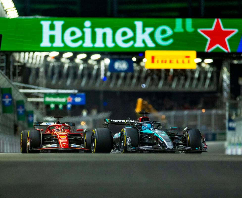 Mercedes driver George Russell leads Ferrari driver Carlos Sainz through turn one during the Fo ...