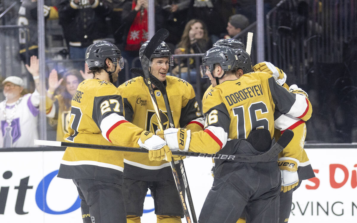 The Golden Knights come together to celebrate their second goal during the first period of the ...