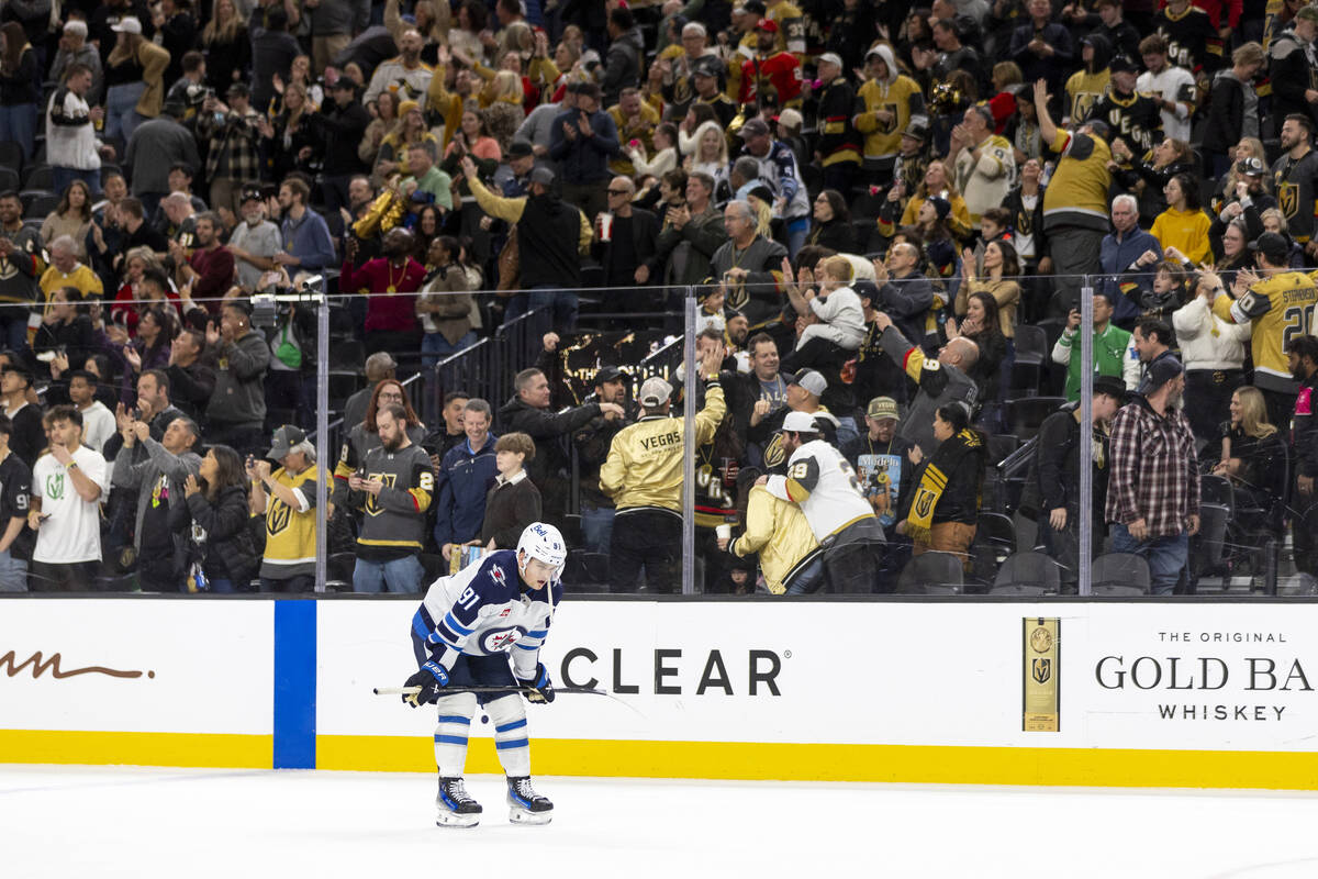 Winnipeg Jets center Cole Perfetti (91) bends over and catches his breath after losing the NHL ...